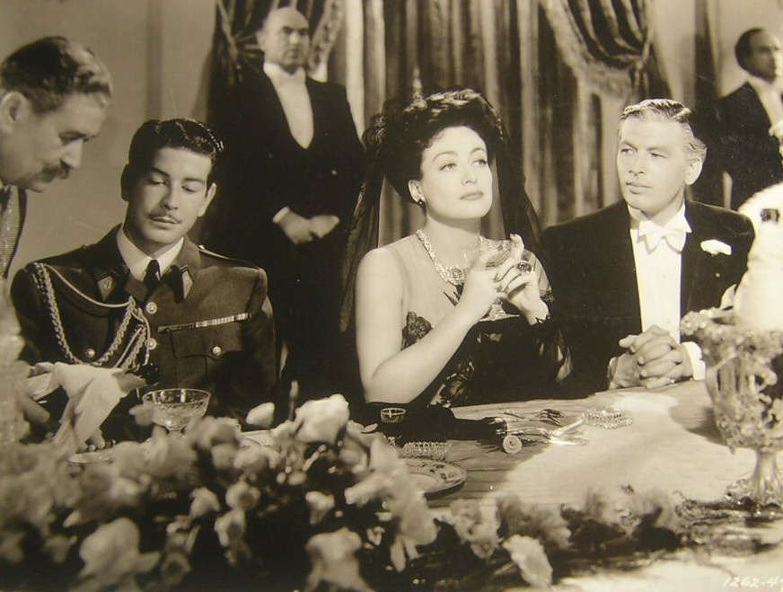 1942. 'Reunion in France.' With Philip Dorn at right.