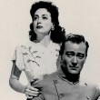 1942. Publicity for 'Reunion in France' with John Wayne.