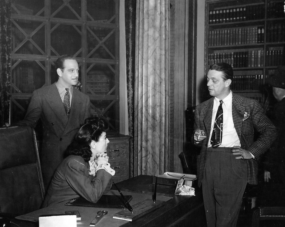 1942. 'They All Kissed the Bride.' On the set with Melvyn Douglas, left, and director Alexander Hall.