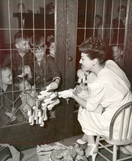 1943. Donating gifts to charity. Or taunting orphans. You decide.