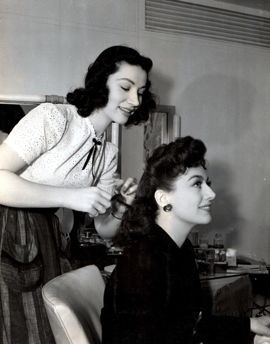 1942. On the set of 'They All Kissed the Bride.'