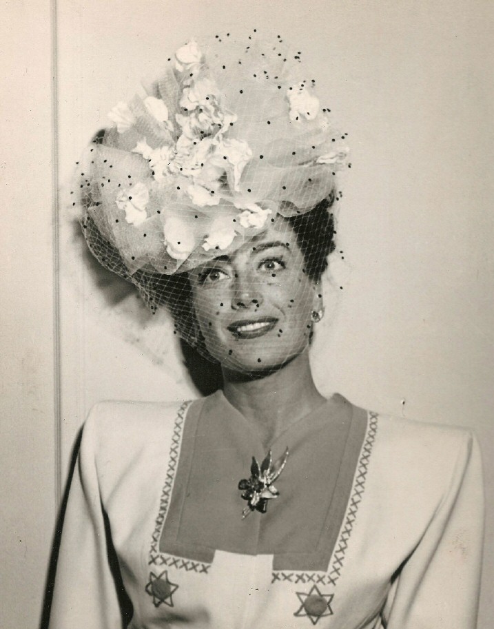 May 1945, at the Beverly Wilshire. Hat by Walter Florell.