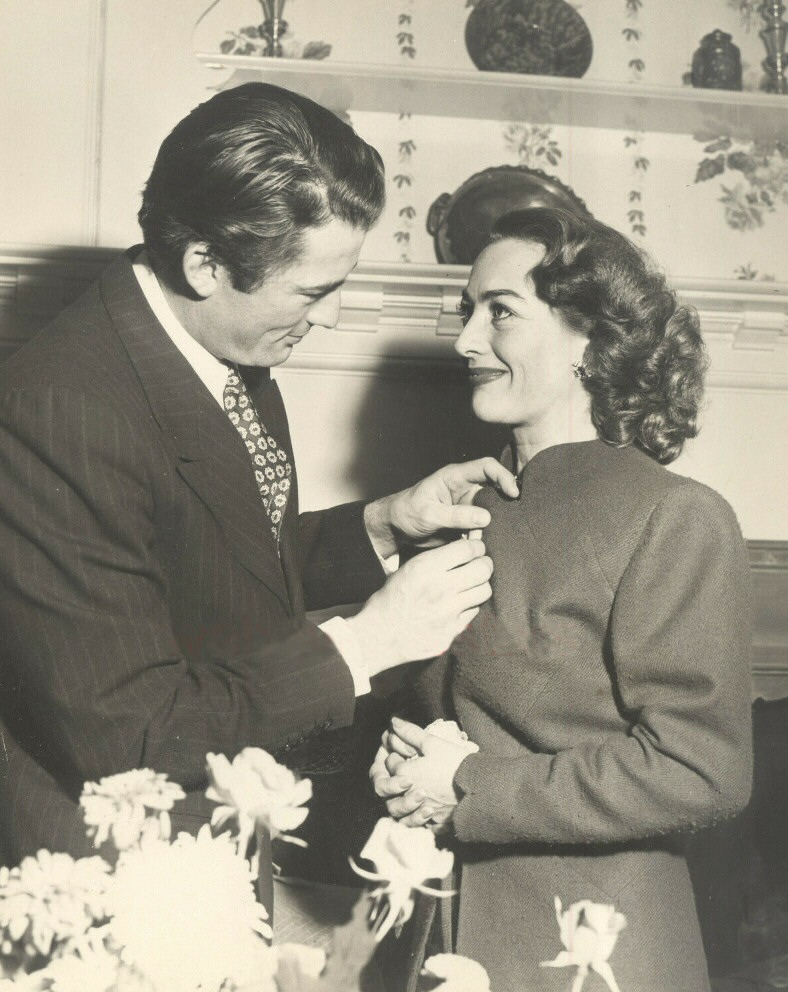 December 1945. Joan and Gregory Peck receive the Golden Apple Award from the Hollywood Women's Press Club for 'Most Cooperative Actor/Actress.'