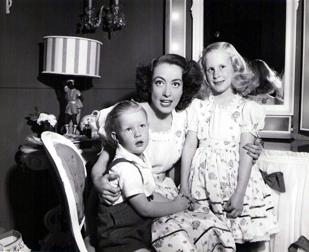 1946. On the set of 'Humoresque' with Christina and Christopher.