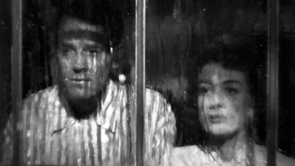 1947. 'Daisy Kenyon' screen shot. Daisy and Peter and the Rain.