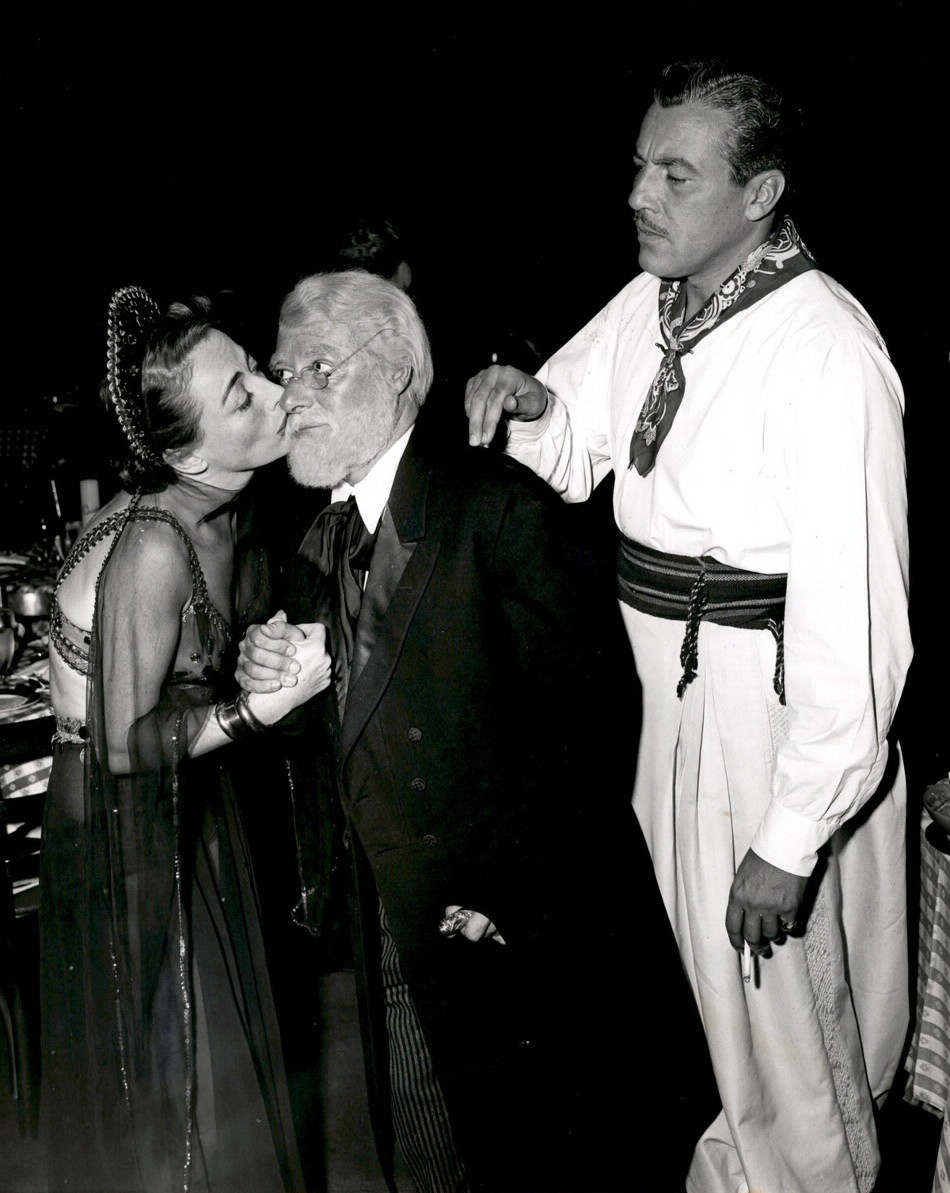 October 1949. Photographers Ball held at Ciro's. With George Jessel and Cesar Romero.