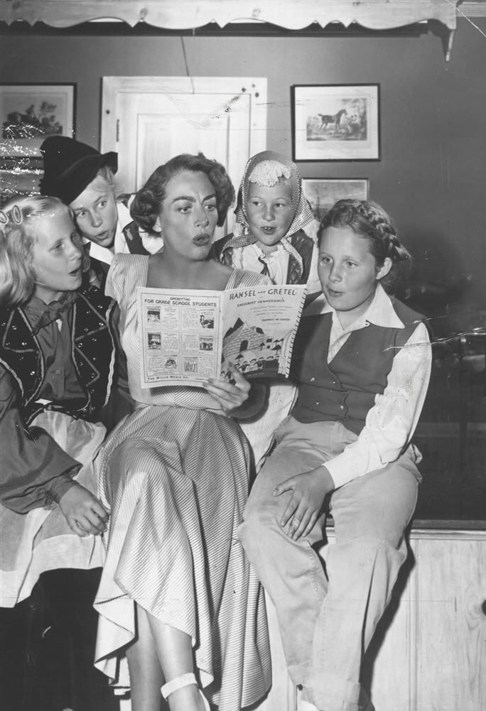 February 1950. Joan directs Christina's Brentwood Brownie troop in a 'Hansel and Gretel' operetta. From left: Christina, Carole Baker, Cynthia Shaw, Jill Marble.