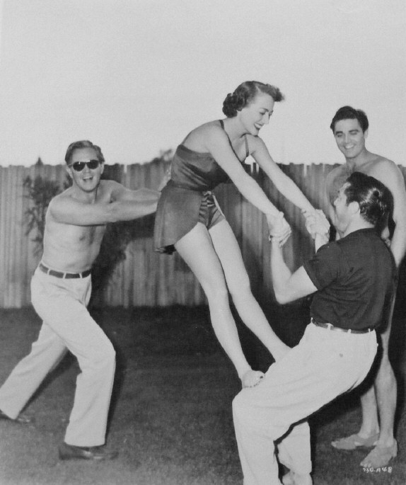 1950. Publicity for 'The Damned Don't Cry.' With David Brian, Steve Cochran, Vince Sherman.