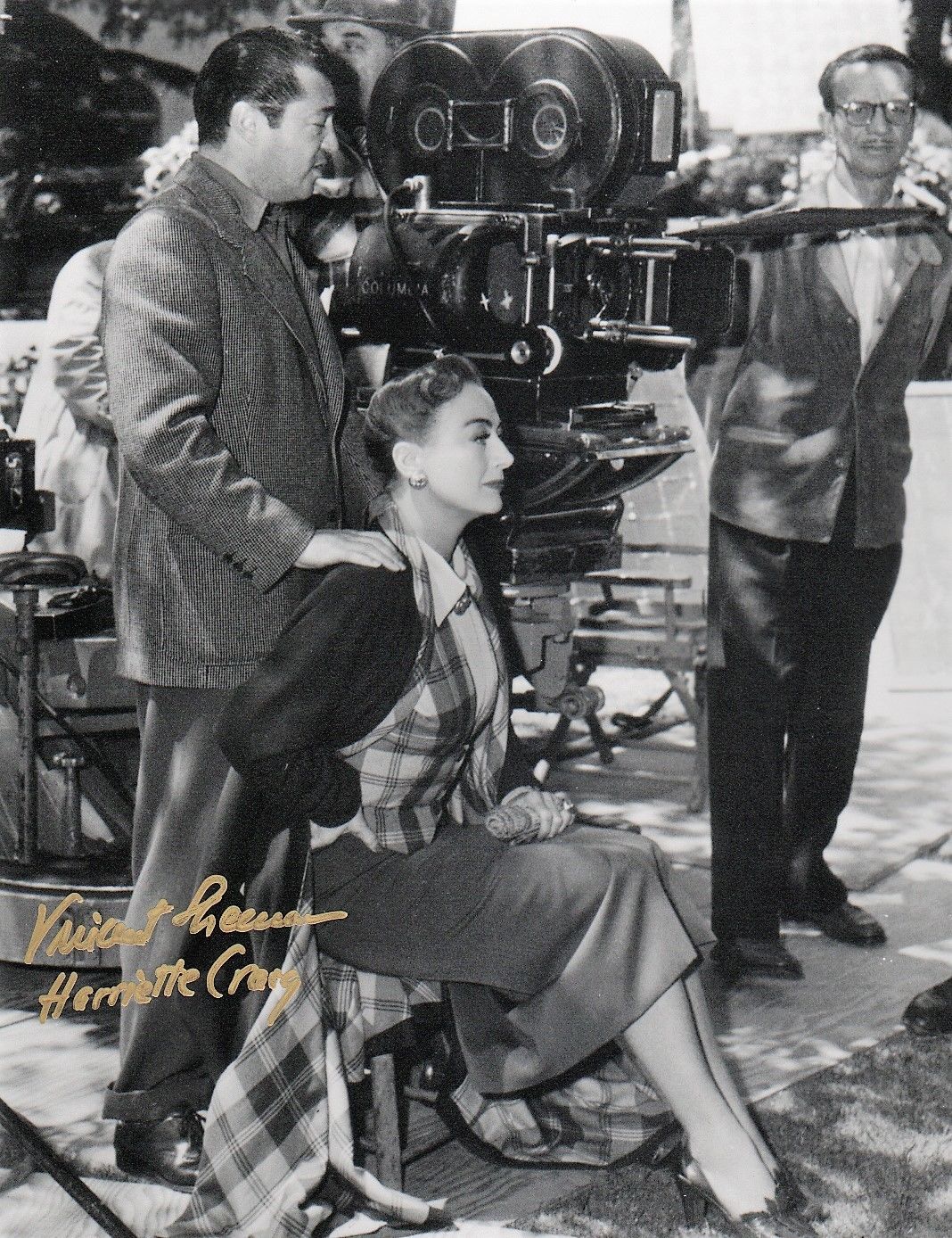 1950. On the set of 'Harriet Craig' with director Vincent Sherman.