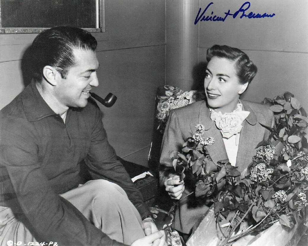 1950. On the set of 'Harriet Craig' with director Vincent Sherman.