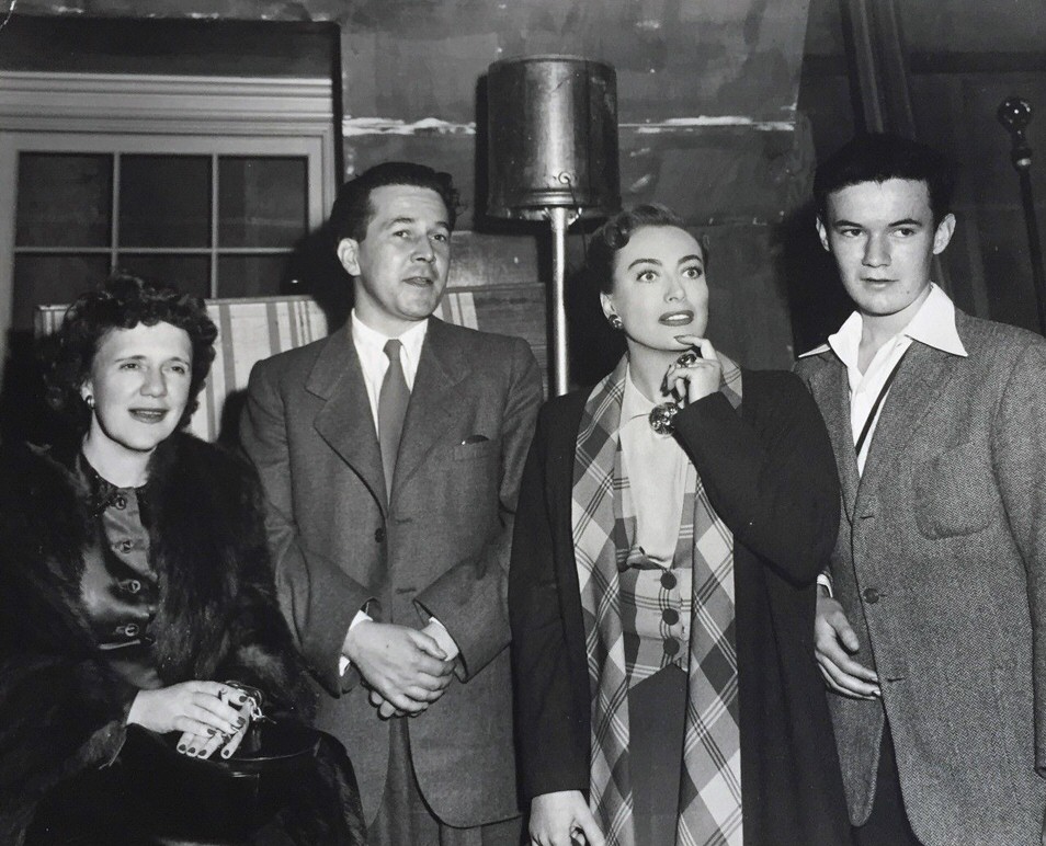 1950. On the set of 'Harriet Craig' with editor Ruth Waterbury, left.