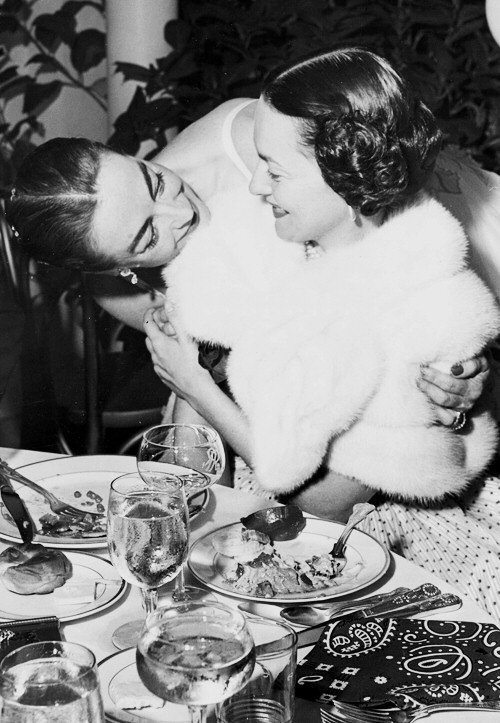 Circa 1953 with Olivia DeHavilland at the Academy Awards.