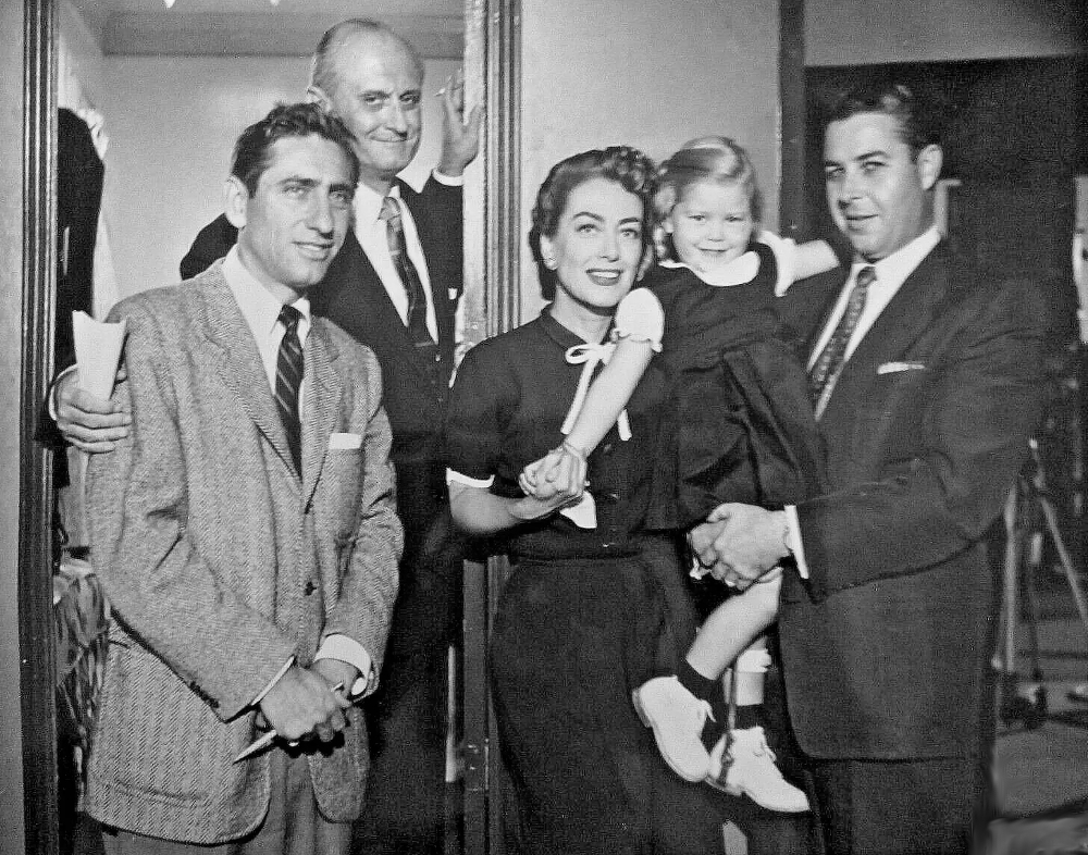 1952. On the set of 'Sudden Fear.' Director David Miller at left.