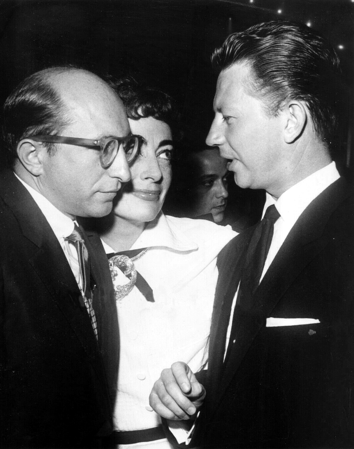 1954. At Chasen's with Sidney Miller, left, and Donald O'Connor. At a party given by Joan for publicist Henry Rogers. Shot by Len Weissman.