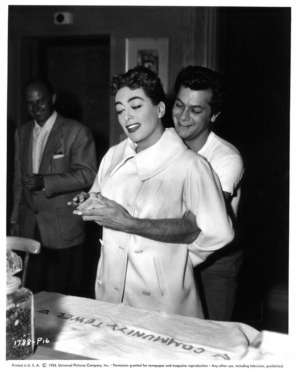 1955. On the set of 'Female on the Beach' with Tony Curtis.