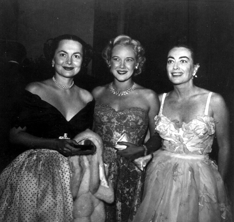 1953. With Olivia de Havilland, left, and unknown.