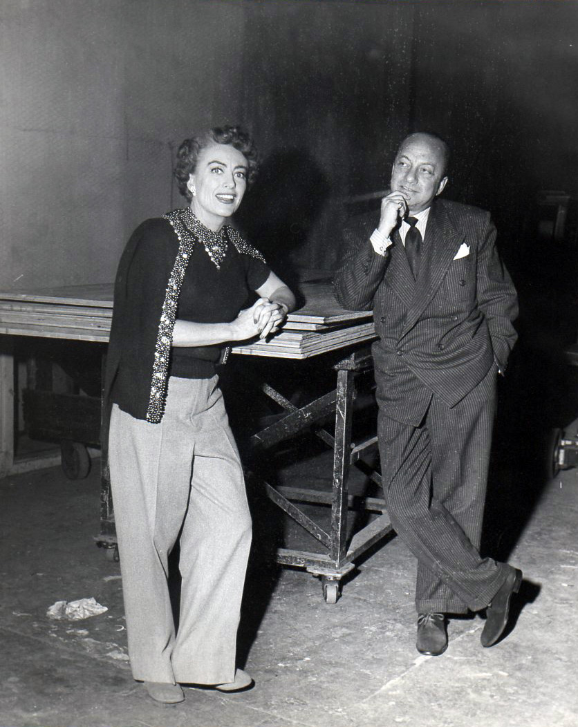 1952. On the set of 'Sudden Fear' with press agent Jerry Asher.