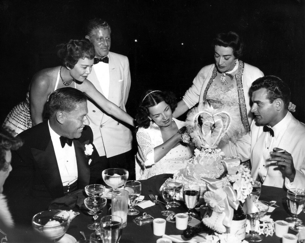 1953. One-year anniversary of goddaughter Joan Evans' wedding to Kirby Weatherly. (Jane Wyman at left.)