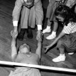 1953. Doing the limbo with help from Christopher. Shot by Len Weissman.