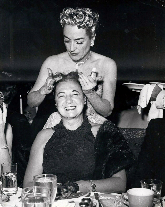 1953. Silvering Mrs. Abel Green's hair at a nightclub.