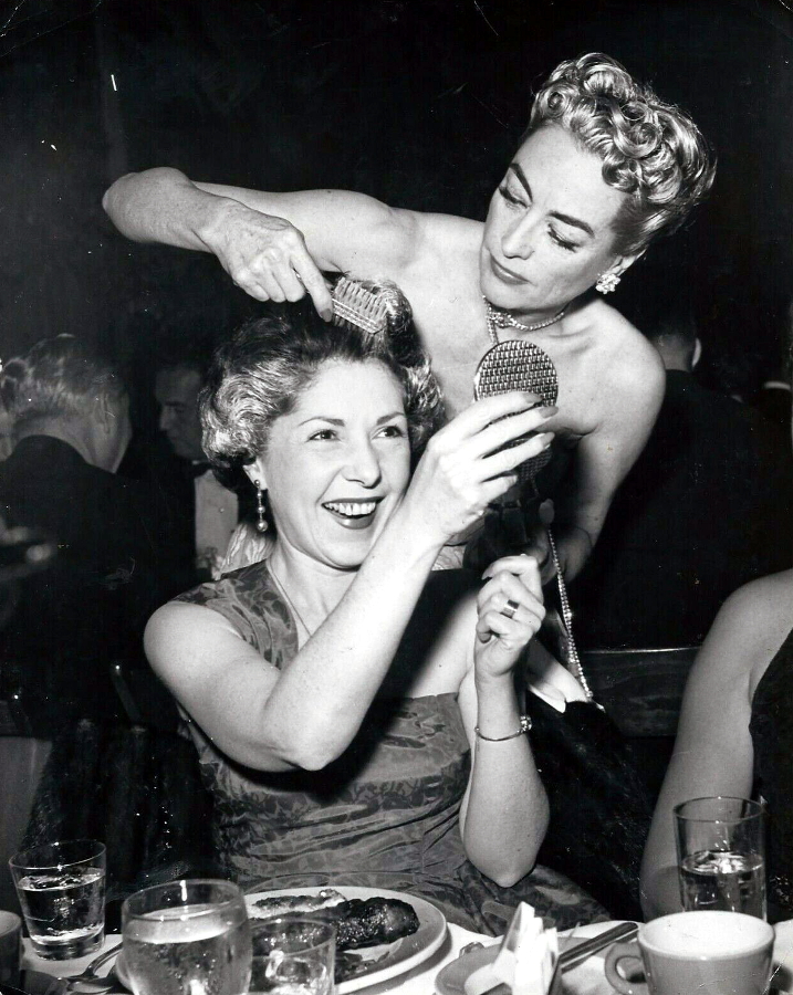 1953. Silvering Mrs. Joe Schoenfeld's hair at a nightclub.