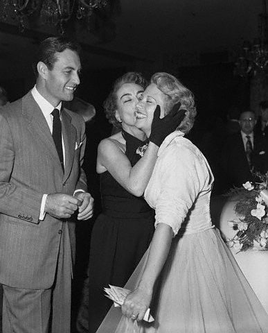 11/30/51. Joan with Dinah Shore and Shore's husband, actor George Montgomery.