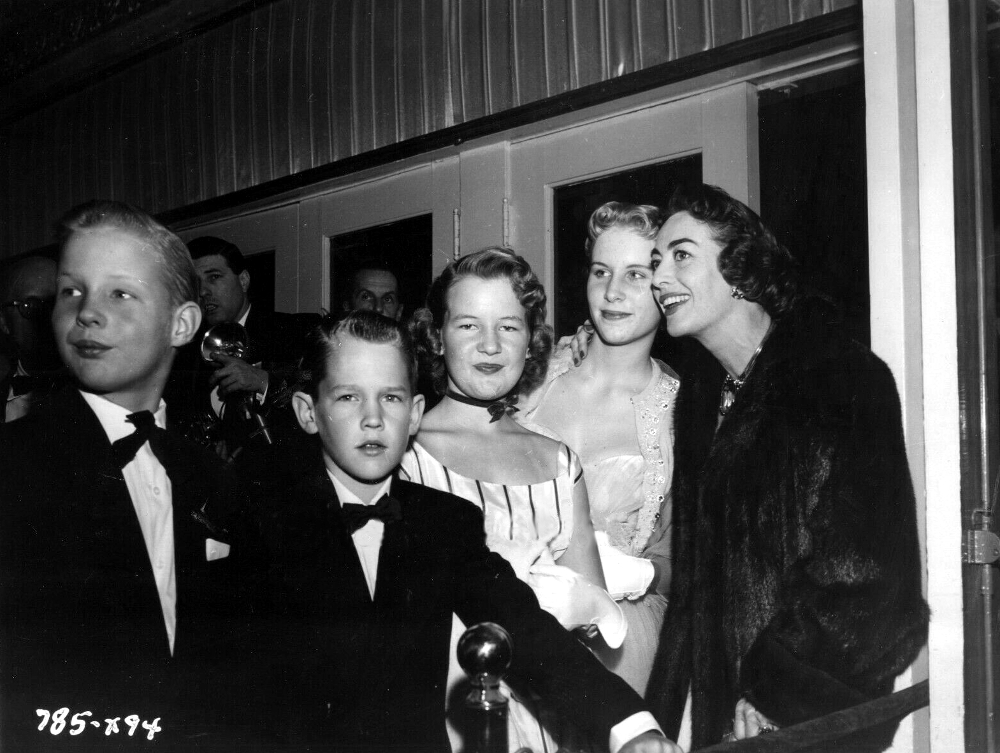 1952. At the premiere of 'The Jazz Singer' with Christina and Christopher.