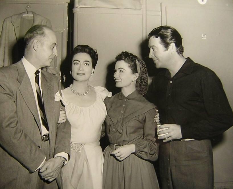 1953. On the set of 'All the Brothers Were Valiant' with director Richard Thorpe, Ann Blyth, and Robert Taylor.