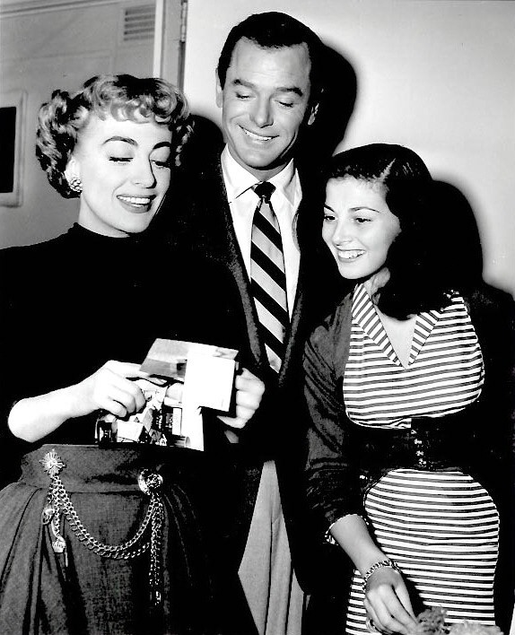 1953. On the set of 'Torch Song.' With Gig Young and Pier Angeli.