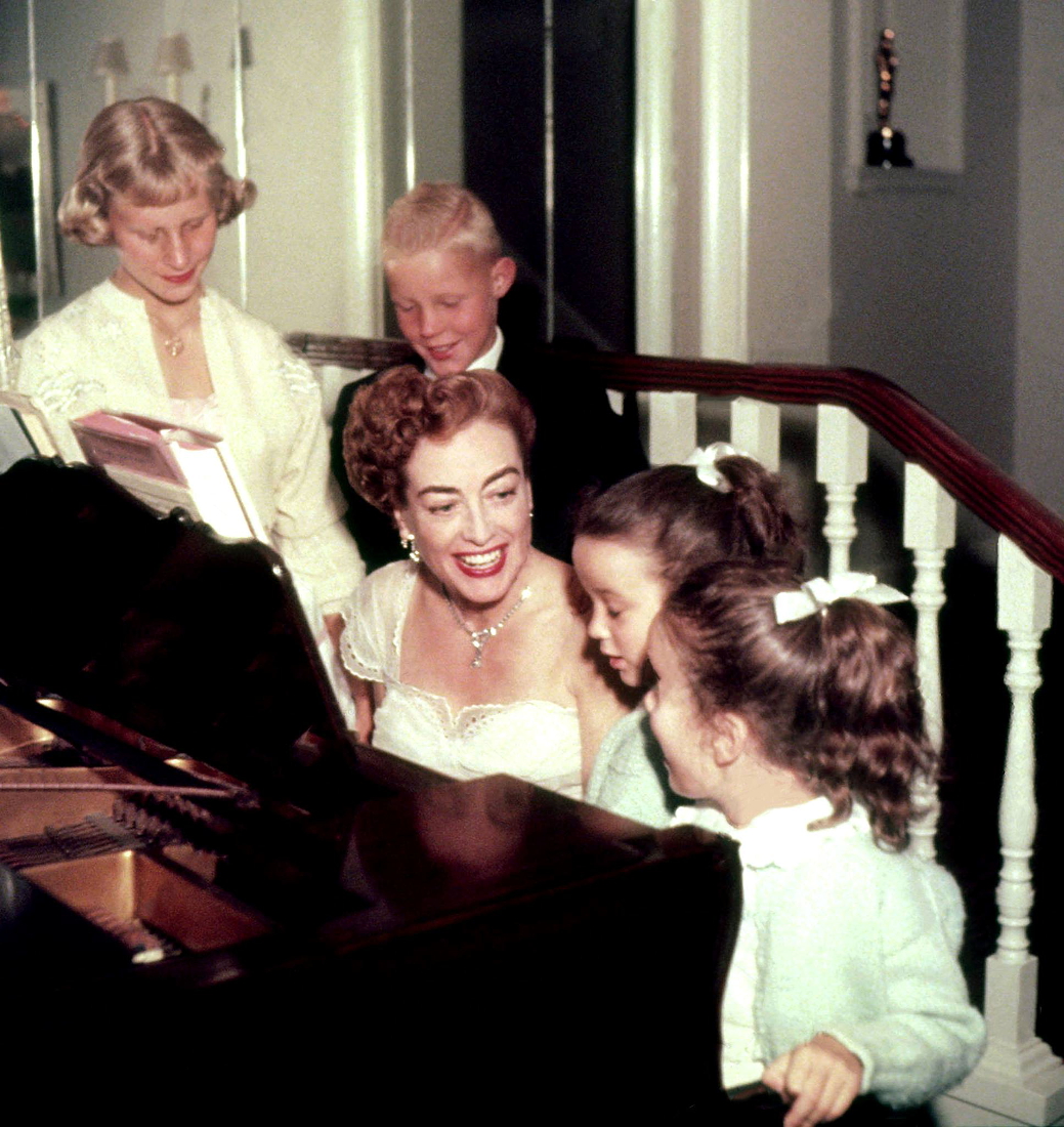 1953. At home with kids. (Note Oscar in nook in background.)