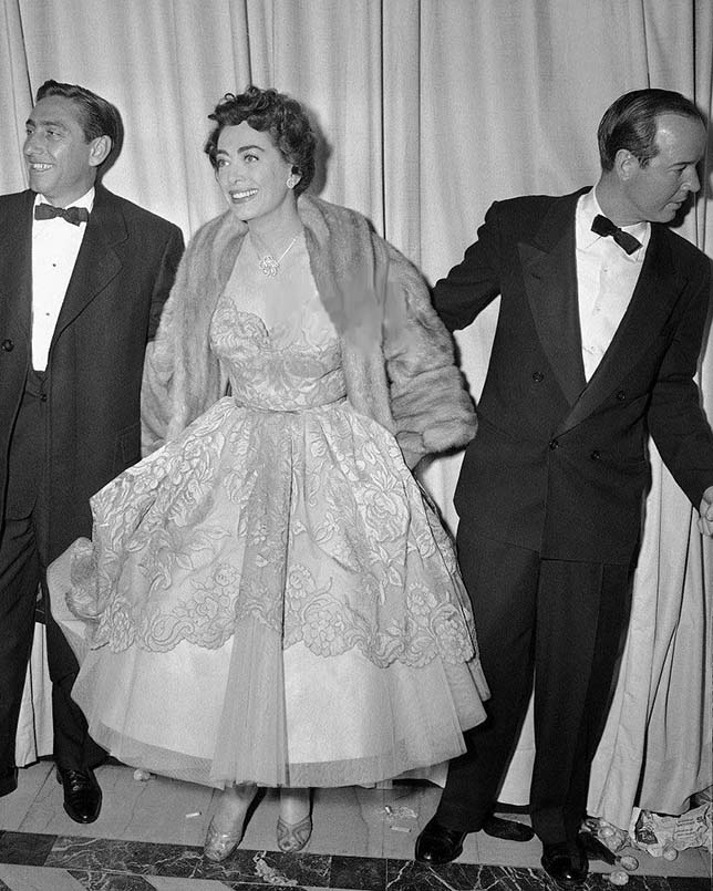 March 19, 1953, at the Pantages Theater for the first televised Oscars. With director David Miller, left, and Earl Blackwell.