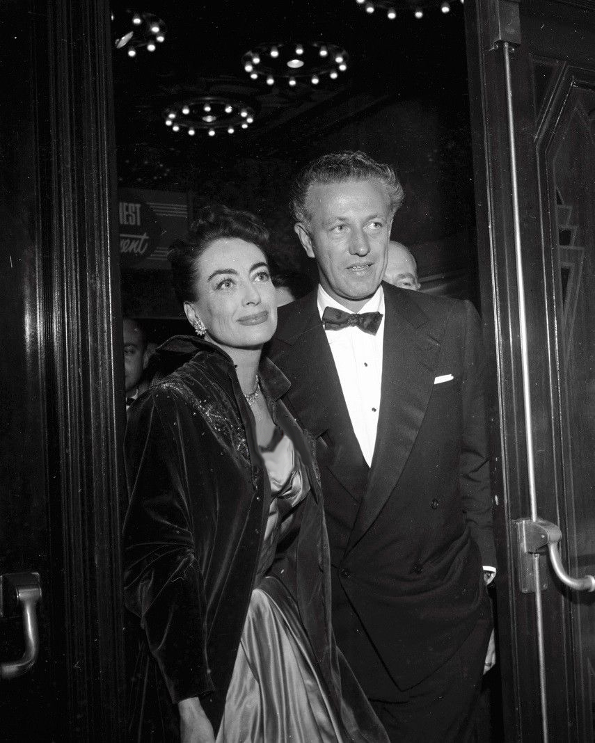 November 1953. At the premiere of 'Torch Song' with 'Johnny Guitar' director Nicholas Ray.