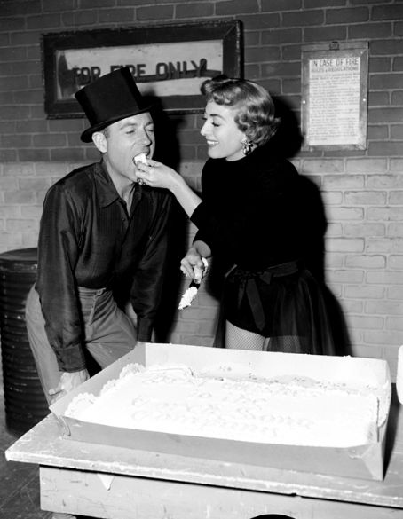 1953. On the 'Torch Song' set with director Charles Walters.
