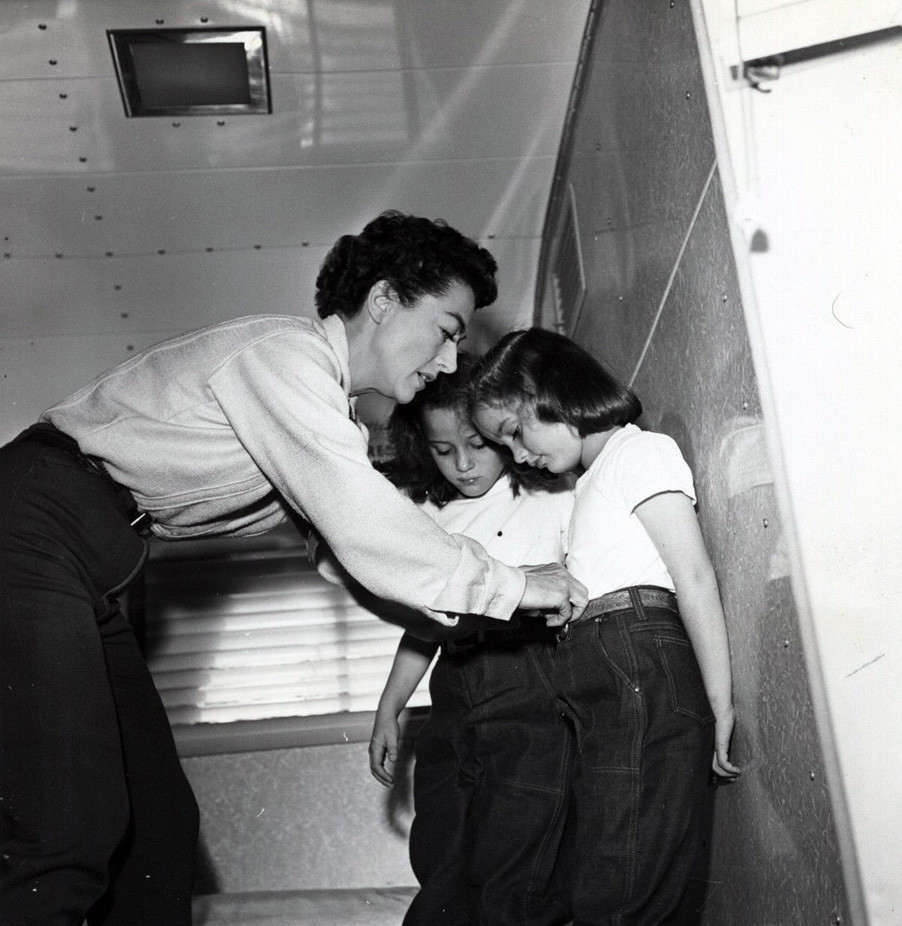 On the set of 'Johnny Guitar' with twins Cathy and Cynthia. Shot by Hyman Fink.