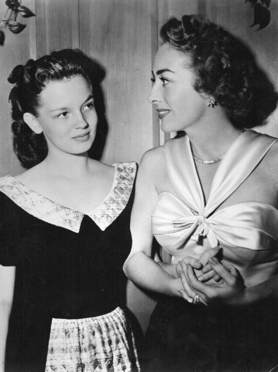 1949. With goddaughter Joan Evans.