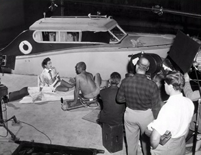 1955 on the set of 'Female on the Beach.'