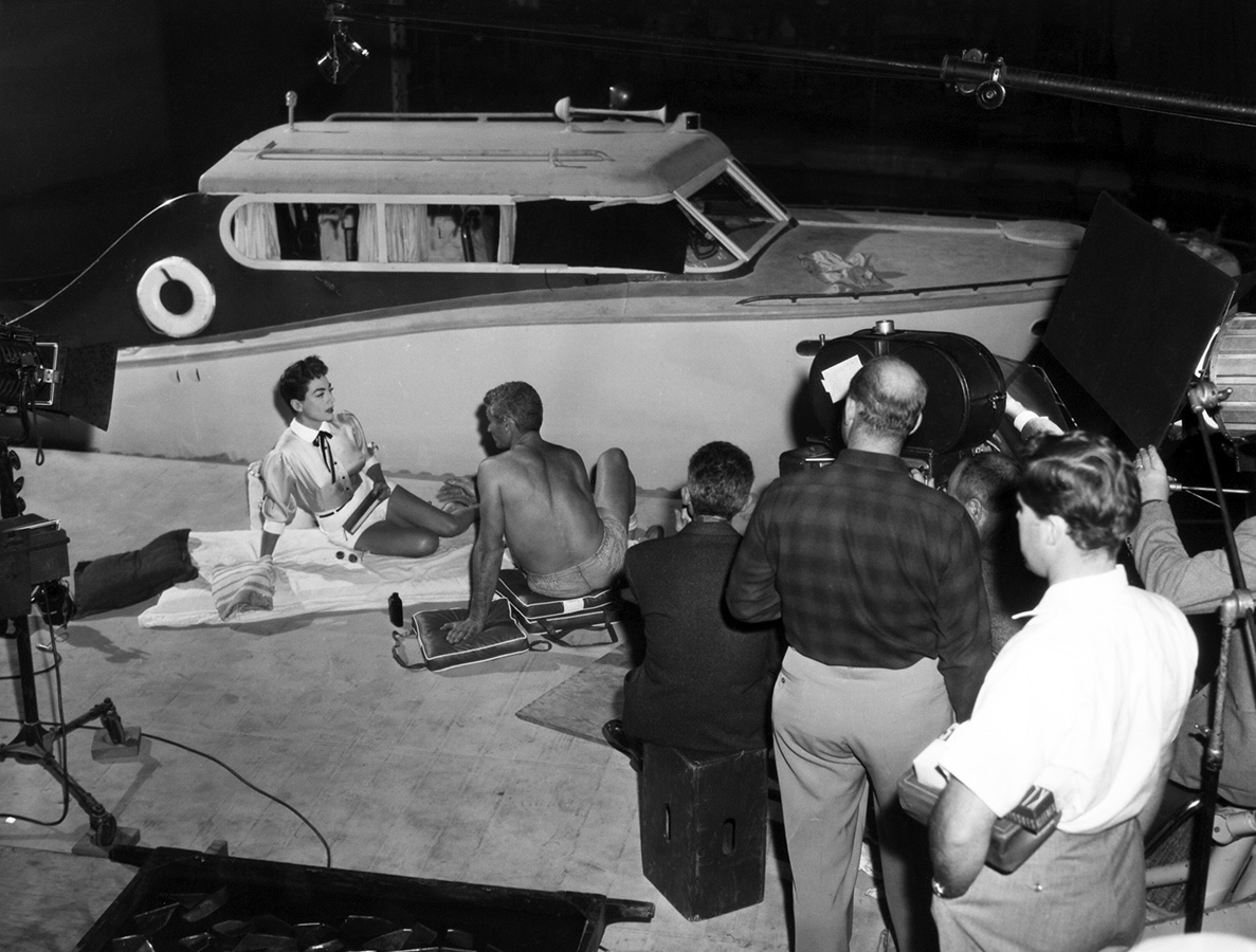 1955. On the set of 'Female on the Beach.'
