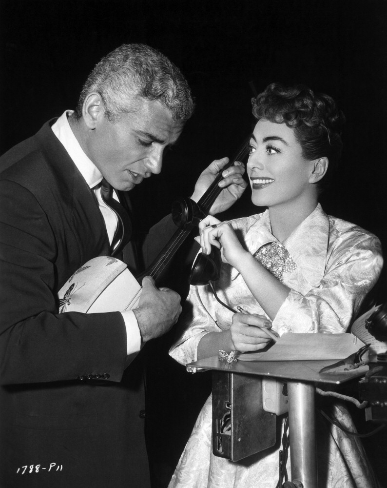 On the set of 'Female on the Beach' with Jeff Chandler.