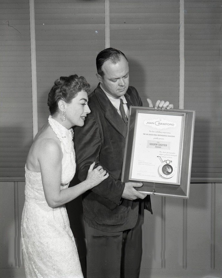 1955. Receiving the Golden Shutter Award from the LA Press Photographers Association.