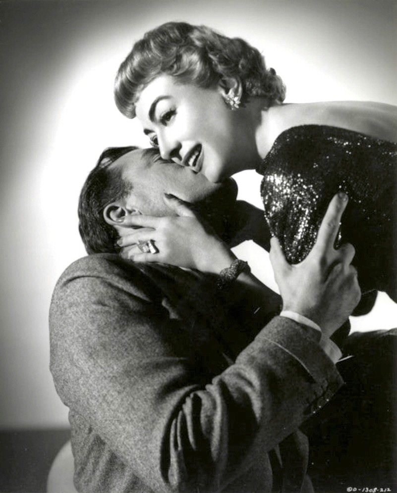 1955. 'Queen Bee' publicity with John Ireland. Shot by Coburn.