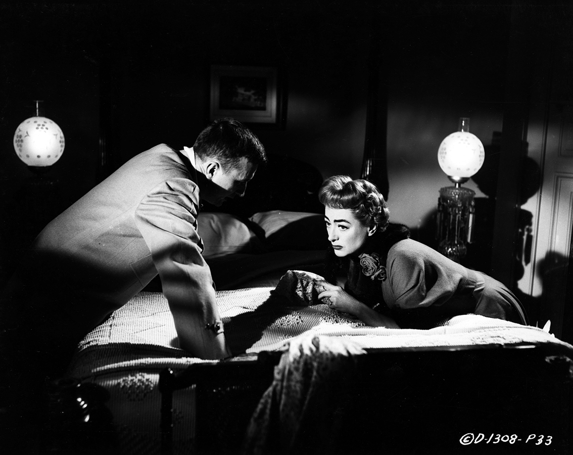 1955. 'Queen Bee.' Conferring with director MacDougall.