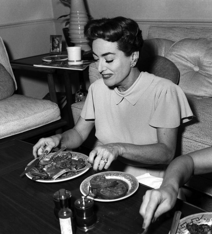 1956. On the set of 'Autumn Leaves' with chicken liver dinner catered by Brown Derby.