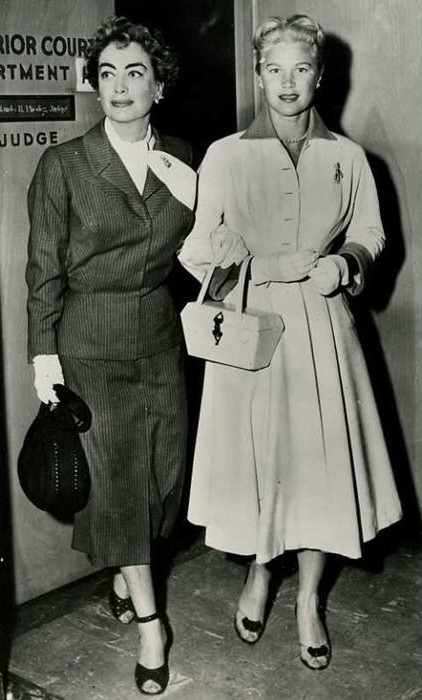 1957. With Joan Caulfield, testifying at the trial of furrier Teitelbaum.