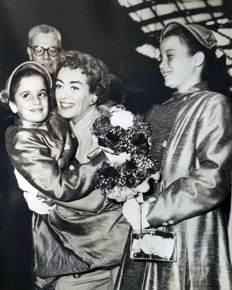 August 1956. The twins arrive in London.