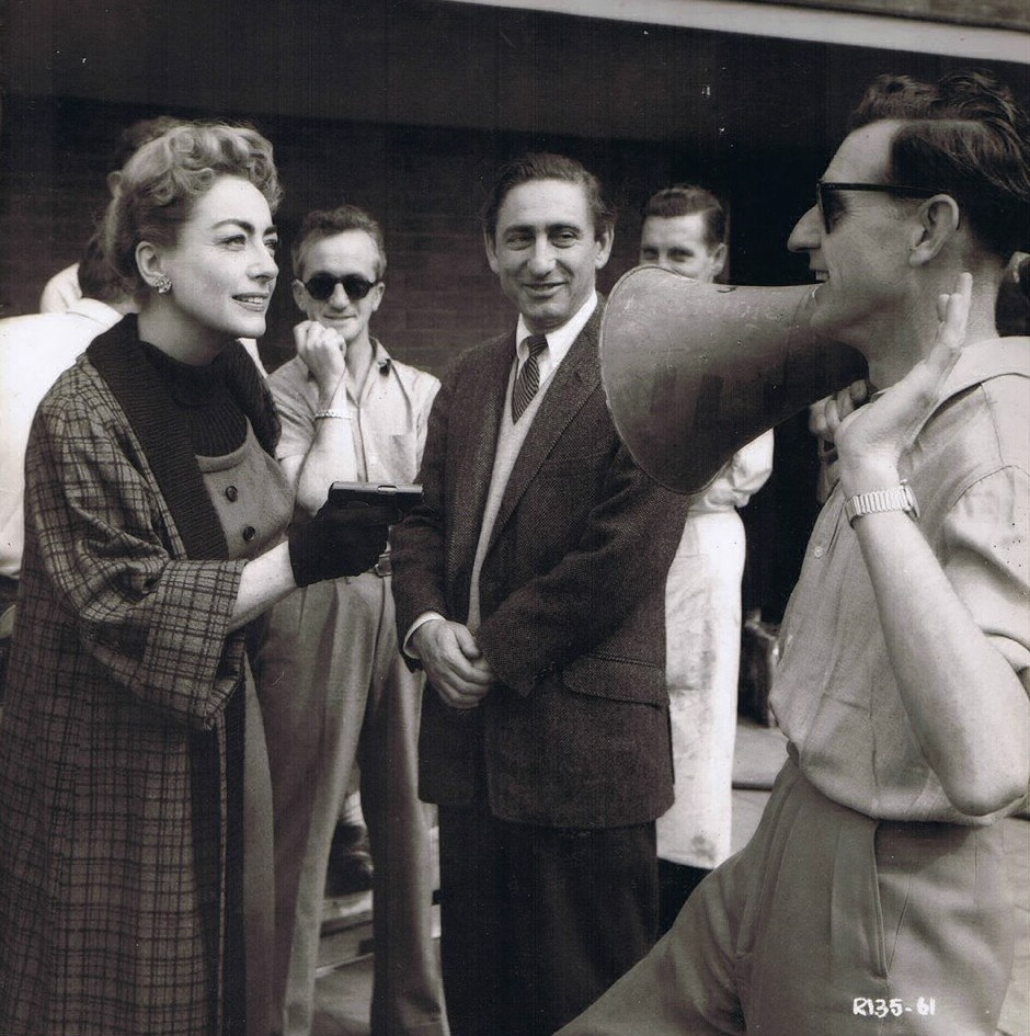 1957. On the set of 'Esther Costello' with director David Miller (center).