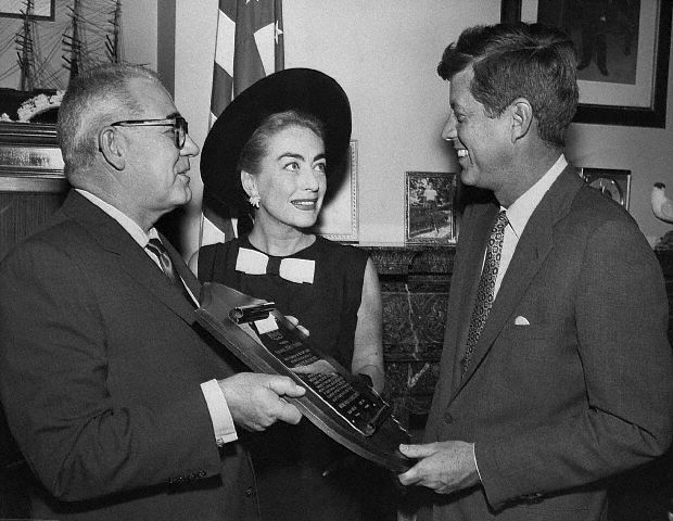 April 17, 1959. Al Steele presents Senator Kennedy with Multiple Sclerosis Society award.