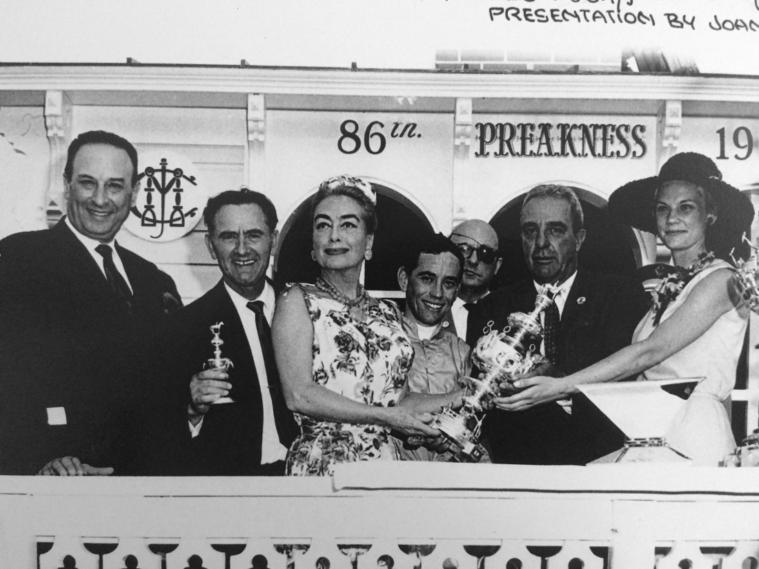 May 1962. Presenting jockey John Rotz with the Preakness trophy.