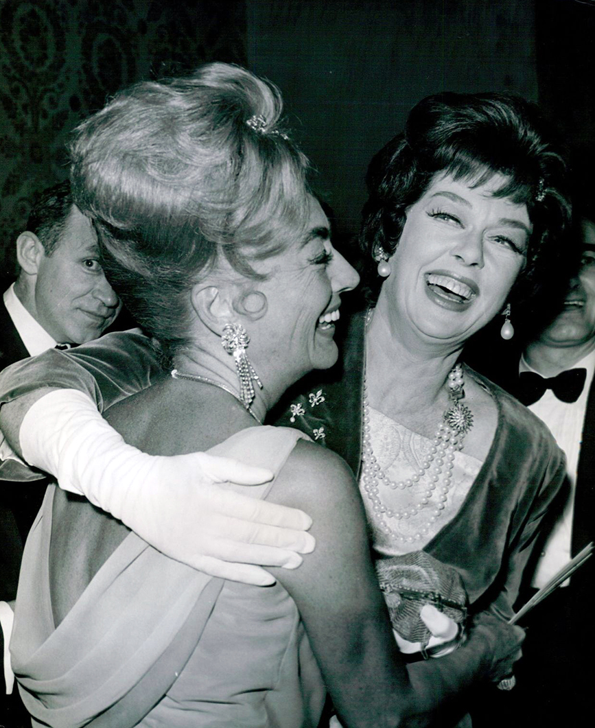 July 1962. Joan and Rosalind Russell at the Beverly Hilton for the Golden Globes awards banquet. 