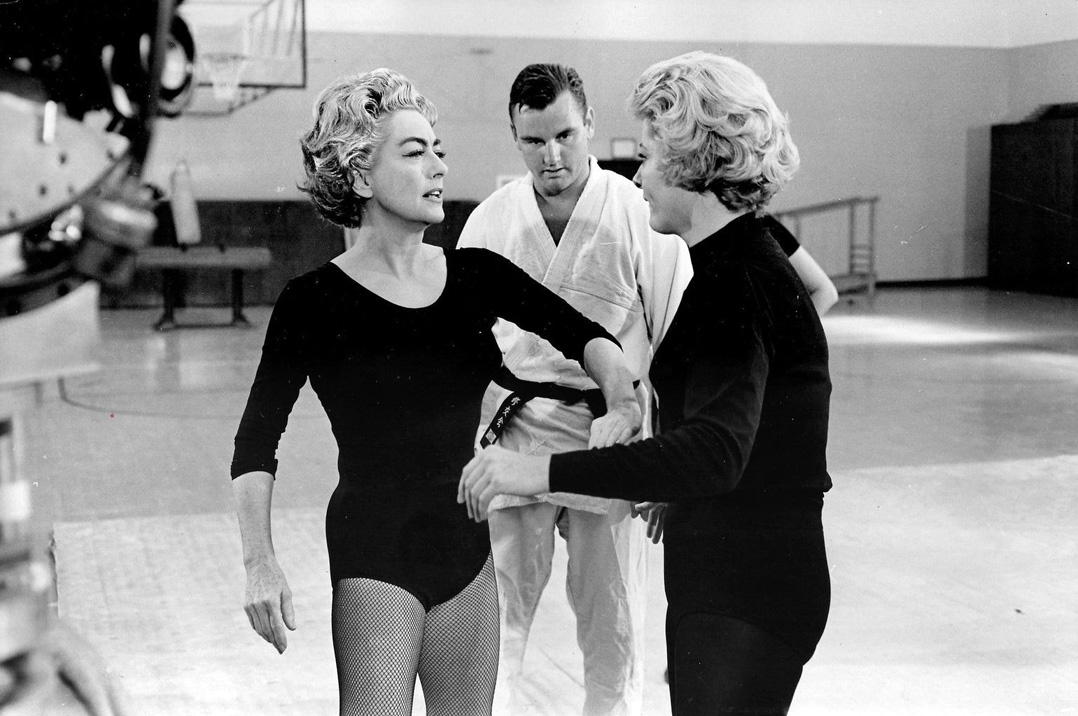 1963. On the set of 'The Caretakers' with instructor Bruce Tegnor and co-star Constance Ford.