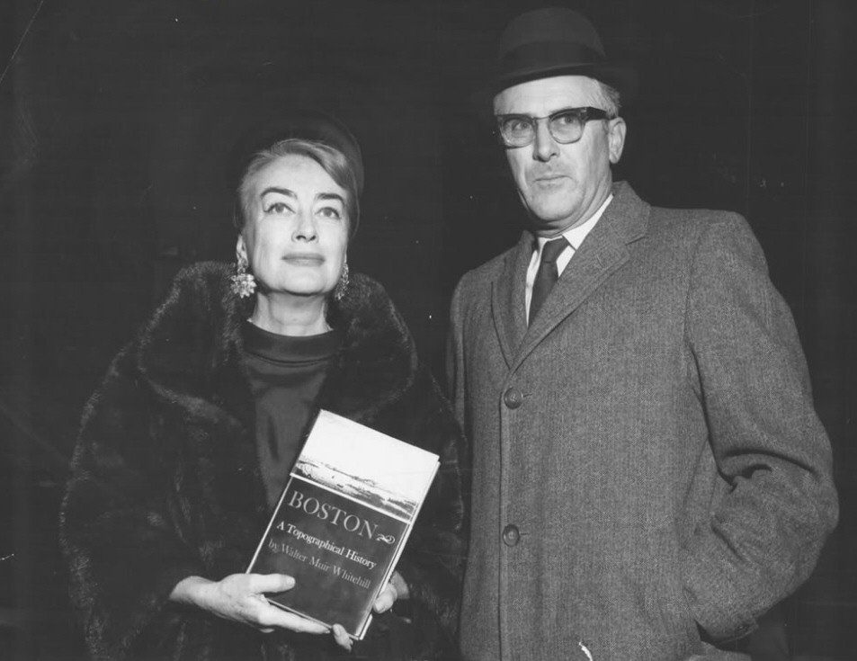 1964. With unknown, holding a history of Boston by Walter Muir Whitehill.